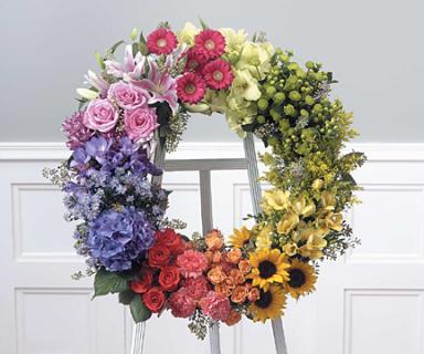 Multi-colored Wreath on easel/Glads,Hypericum,Roses,Gerbs,Carns,