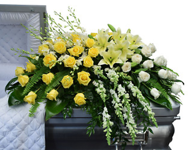 A Joy Casket Spray/Lilies,Roses,Snaps
